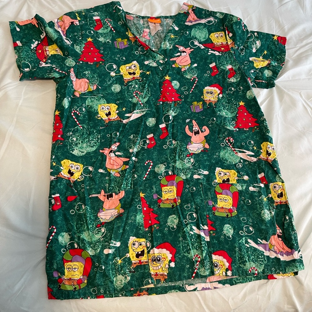 Nickelodeon scrub top. Size is either small or xsmall, tag is faded. Sponge bob